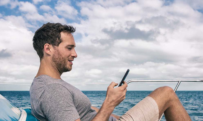 man-foredeck-phone-sea.jpg
