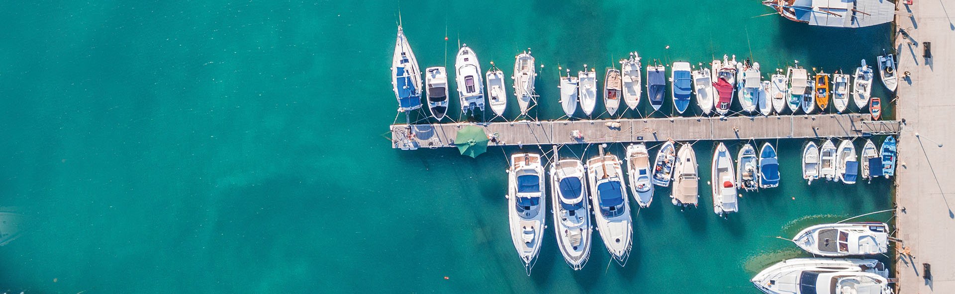 boats-jetty-turquoise-water.jpg